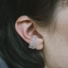 Handmade filigree ear cuff in sterling silver on the ear