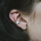 Handmade filigree ear cuff in sterling silver on the ear