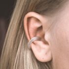 Handmade filigree ear cuff in sterling silver on the ear