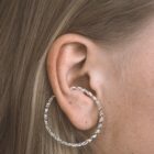 Handmade filigree ear cuff in sterling silver on the ear