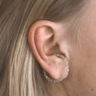 Handmade filigree ear cuff in sterling silver on the ear