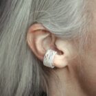 Handmade filigree ear cuff in sterling silver on the ear